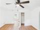Bedroom featuring wood-look floors, ceiling fan and a closet with doors ajar to show shelving inside at 2203 Second Ave, Decatur, GA 30032