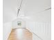 Attic bonus room space with laminated flooring, beadboard paneling, and natural light at 2203 Second Ave, Decatur, GA 30032