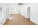 Bright living room features wood floors, ceiling fan, and large windows for natural light at 2203 Second Ave, Decatur, GA 30032