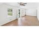 Open living room with laminated flooring, natural light, and ceiling fan at 2203 Second Ave, Decatur, GA 30032