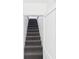 Staircase with gray carpeting leading upstairs at 2203 Second Ave, Decatur, GA 30032