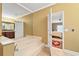 Bathroom featuring a jacuzzi-style tub and view to the bedroom at 3071 Lenox Ne Rd # 19, Atlanta, GA 30324