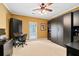 Spacious bedroom featuring dark wood custom cabinets, desk, and neutral carpet at 3071 Lenox Ne Rd # 19, Atlanta, GA 30324