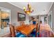 Open-concept dining room flows into the living room and kitchen with chandelier at 3071 Lenox Ne Rd # 19, Atlanta, GA 30324