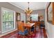 Traditional dining room with hardwood floors, chandelier, and bright windows at 3071 Lenox Ne Rd # 19, Atlanta, GA 30324