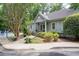 Beautiful exterior view of the home showcasing manicured landscaping and a community pool nearby at 3071 Lenox Ne Rd # 19, Atlanta, GA 30324
