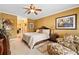 Spacious bedroom with decorative chair rail, ceiling fan, sitting chair, and art at 3071 Lenox Ne Rd # 19, Atlanta, GA 30324