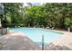 Sparkling community pool surrounded by lounge chairs and lush greenery, perfect for relaxation at 3071 Lenox Ne Rd # 19, Atlanta, GA 30324