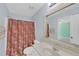 Bathroom with a single sink, mirror, shower with curtain, and doorway leading to a bedroom at 5013 Centennial Commons Nw Dr, Acworth, GA 30102