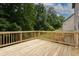 A wooden deck provides an outdoor space perfect for relaxing and entertaining at 565 Lance View Ln, Lawrenceville, GA 30045