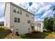 Exterior view of back of house featuring a deck, siding, and a grassy lawn at 565 Lance View Ln, Lawrenceville, GA 30045