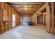 Unfinished basement featuring exposed wood framing and a concrete floor, ready for customization at 565 Lance View Ln, Lawrenceville, GA 30045