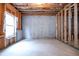 Unfinished basement with a window and wood framing ready for customization and expansion at 565 Lance View Ln, Lawrenceville, GA 30045