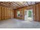 Unfinished basement featuring an egress door and window ready for customization at 565 Lance View Ln, Lawrenceville, GA 30045