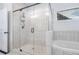 Elegant bathroom with a glass shower, a built-in tub, and sleek tile flooring at 565 Lance View Ln, Lawrenceville, GA 30045