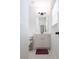 Clean bathroom with white cabinetry, a well-lit mirror, and a tiled floor at 565 Lance View Ln, Lawrenceville, GA 30045