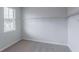 Walk-in closet with a window and white shelving at 565 Lance View Ln, Lawrenceville, GA 30045