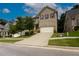 Charming two-story brick home with a manicured lawn and a two-car garage at 565 Lance View Ln, Lawrenceville, GA 30045