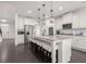 Bright kitchen features a large island with seating, stainless steel appliances, and white cabinets at 565 Lance View Ln, Lawrenceville, GA 30045