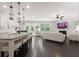 Open-concept kitchen flows into a stylish living room with modern fixtures and fireplace at 565 Lance View Ln, Lawrenceville, GA 30045