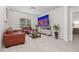 Comfortable living room with brown leather seating, modern decor, and a large screen TV at 565 Lance View Ln, Lawrenceville, GA 30045