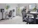 A bright office space with minimalist design, including a sleek desk, ergonomic chair, and natural light at 565 Lance View Ln, Lawrenceville, GA 30045
