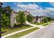 Charming home showcasing curb appeal with lush landscaping and well-maintained lawn at 565 Lance View Ln, Lawrenceville, GA 30045