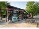 Outdoor patio with tables and umbrellas, perfect for enjoying a meal or drink outside at 655 Willoughby Ne Way, Atlanta, GA 30312