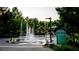 Gathering-friendly splash pad with playful water features surrounded by lush greenery and a sign at 655 Willoughby Ne Way, Atlanta, GA 30312