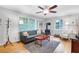 Cozy living room boasts hardwood floors, a vintage stove, and lots of natural light at 108 Glenn St, Decatur, GA 30030