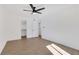 Bright bedroom with a ceiling fan, wood floors, and a convenient closet space at 2396 Lawrenceville Hwy # V, Decatur, GA 30033