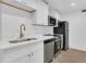 Updated kitchen with stainless steel appliances, quartz countertops, and modern fixtures at 2396 Lawrenceville Hwy # V, Decatur, GA 30033