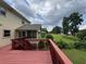 Outdoor deck showcasing mature landscaping and a screened-in porch overlooking the backyard at 25 Darcee Ct, Lawrenceville, GA 30046