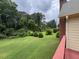 View of a lush green backyard from the deck at 25 Darcee Ct, Lawrenceville, GA 30046
