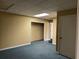 Basement featuring neutral walls and a door leading to another part of the house at 25 Darcee Ct, Lawrenceville, GA 30046