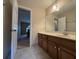 Bathroom featuring a dark wooden cabinet with granite countertops at 25 Darcee Ct, Lawrenceville, GA 30046
