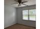 Bedroom featuring a ceiling fan and natural lighting at 25 Darcee Ct, Lawrenceville, GA 30046