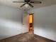 Bedroom featuring an en-suite bathroom and ceiling fan at 25 Darcee Ct, Lawrenceville, GA 30046