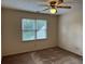 Bedroom featuring a ceiling fan and natural lighting at 25 Darcee Ct, Lawrenceville, GA 30046