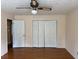 Bedroom featuring hardwood floors and a large closet at 25 Darcee Ct, Lawrenceville, GA 30046
