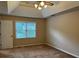 Bedroom with trey ceilings, ceiling fan and natural lighting at 25 Darcee Ct, Lawrenceville, GA 30046