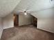 Spacious bonus room with neutral walls and a ceiling fan at 25 Darcee Ct, Lawrenceville, GA 30046