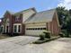 Traditional brick home with an attached two-car garage and a concrete driveway at 25 Darcee Ct, Lawrenceville, GA 30046