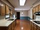 Traditional kitchen with wood cabinets, hardwood floors, and ample counter space at 25 Darcee Ct, Lawrenceville, GA 30046