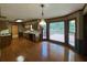 Open kitchen with wood floors, matching cabinets, and access to the backyard deck at 25 Darcee Ct, Lawrenceville, GA 30046
