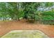 Leafy backyard featuring a tiered terrace at 3300 Suttles Sw Dr, Atlanta, GA 30331