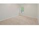 Well-lit bedroom with neutral carpet and walls, ready for customization at 3300 Suttles Sw Dr, Atlanta, GA 30331