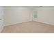 A bright bedroom with soft carpet and a window overlooking trees at 3300 Suttles Sw Dr, Atlanta, GA 30331
