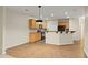 Modern kitchen with bar seating, wood cabinetry, and stainless steel appliances at 3300 Suttles Sw Dr, Atlanta, GA 30331