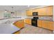 Well-equipped kitchen with ample counter space, wood cabinets, and a gas range at 3300 Suttles Sw Dr, Atlanta, GA 30331